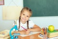 Young child girl drawing or writing with colorful pencils in not Royalty Free Stock Photo