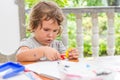 young child girl writing in notebook, outdoors portrait, education idea Royalty Free Stock Photo