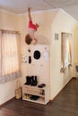 Young child hanging up side down in home Royalty Free Stock Photo