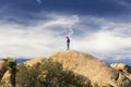 Young Child Joshua Tree National Park Boulder Landscape Dramatic Sky California USA