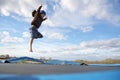 Young Child Jumping on Outdoor Family Trampoline Royalty Free Stock Photo