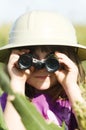 A young child looking through binoculars Royalty Free Stock Photo