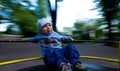 Young child on merry-go-round Royalty Free Stock Photo