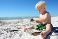 Young Child Playing in Sand at Beach Royalty Free Stock Photo