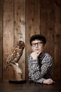 Young child, portrait and confident with thinking by owl, pride and vintage fashion with glasses in mockup. Boy, face