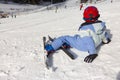 Young Child rests on the edge of a ski slope