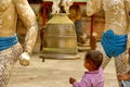 Child ringing a bell