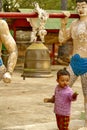 Child ringing a bell