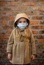 A young child`s mask to protect the outbreaks