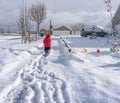 Young Child Shoveling Snow