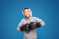 Young child sportsman in boxing gloves