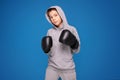 Young child sportsman in boxing gloves