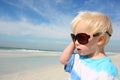 Young Child in Sunglasses Looking at the Ocean Royalty Free Stock Photo