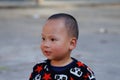 A young child in a village near the rice fields of Yunnan, China. Royalty Free Stock Photo