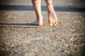 Young child walking barefoot on a beach Royalty Free Stock Photo