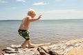 Young Child Walking on Beach Royalty Free Stock Photo