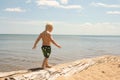 Young Child Walking on Beach Royalty Free Stock Photo