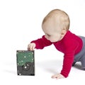 Young child in white background with hard drive Royalty Free Stock Photo