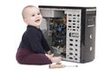 Young child wit screwdriver and ram Royalty Free Stock Photo