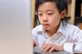 young child working hard in front of computer Royalty Free Stock Photo