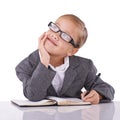Young child, writing and dreaming in studio for business, career and happy with idea of office job. Little girl, suit or