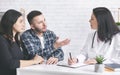Young childless couple consulting with doctor at clinic Royalty Free Stock Photo