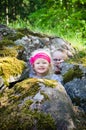 Young children, the boy with girl hid among the rocks