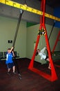 Young children swing on the ropes at the Boston Science Museum