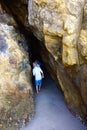 Children Enter Cave Seaside to Explore Vertical Royalty Free Stock Photo