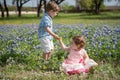 Young Children in Field of Blue Bonnet Flowers Royalty Free Stock Photo