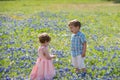 Young Children in Field of Blue Bonnet Flowers Royalty Free Stock Photo