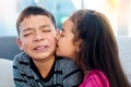 Young, children and kiss with disgust, funny and play in home as kids in youth. Siblings, expression and embarrassed as Royalty Free Stock Photo