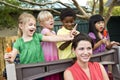 Young children playing in daycare with teacher Royalty Free Stock Photo