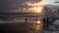 Young children playing on the stormy sea