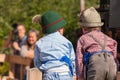 Young children in typical costume during an autumn local celebration in Val di Funes South Tyrol