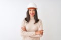 Young chinese architect woman wearing security helmet over isolated white background happy face smiling with crossed arms looking Royalty Free Stock Photo