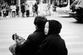 Young chinese girl with a black hood on the scooter