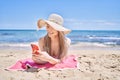 Young chinese girl wearing bikini using smartphone at the beach Royalty Free Stock Photo