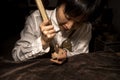 Young Chinese violin maker at work in her workshop Royalty Free Stock Photo