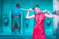 Chinese woman is getting ready to clean up male dirty toilet Royalty Free Stock Photo