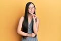 Young chinese woman wearing business dress and glasses smiling looking confident at the camera with crossed arms and hand on chin Royalty Free Stock Photo