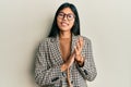 Young chinese woman wearing business style and glasses clapping and applauding happy and joyful, smiling proud hands together Royalty Free Stock Photo