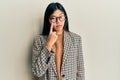 Young chinese woman wearing business style and glasses pointing to the eye watching you gesture, suspicious expression Royalty Free Stock Photo