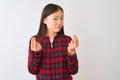 Young chinese woman wearing casual jacket standing over isolated white background doing money gesture with hands, asking for Royalty Free Stock Photo