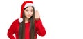 Young chinese woman wearing christmas hat doing italian gesture with hand and fingers confident expression