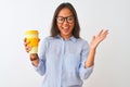 Young chinese woman wearing glasses holding glass of coffee over  white background very happy and excited, winner Royalty Free Stock Photo