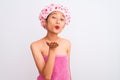 Young chinese woman wearing shower towel and cap bath over isolated white background looking at the camera blowing a kiss with Royalty Free Stock Photo