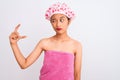 Young chinese woman wearing shower towel and cap bath over isolated white background smiling and confident gesturing with hand Royalty Free Stock Photo