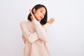 Young chinese woman wearing turtleneck sweater standing over isolated white background Rejection expression crossing arms doing Royalty Free Stock Photo