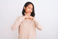 Young chinese woman wearing turtleneck sweater standing over isolated white background Rejection expression crossing fingers doing Royalty Free Stock Photo